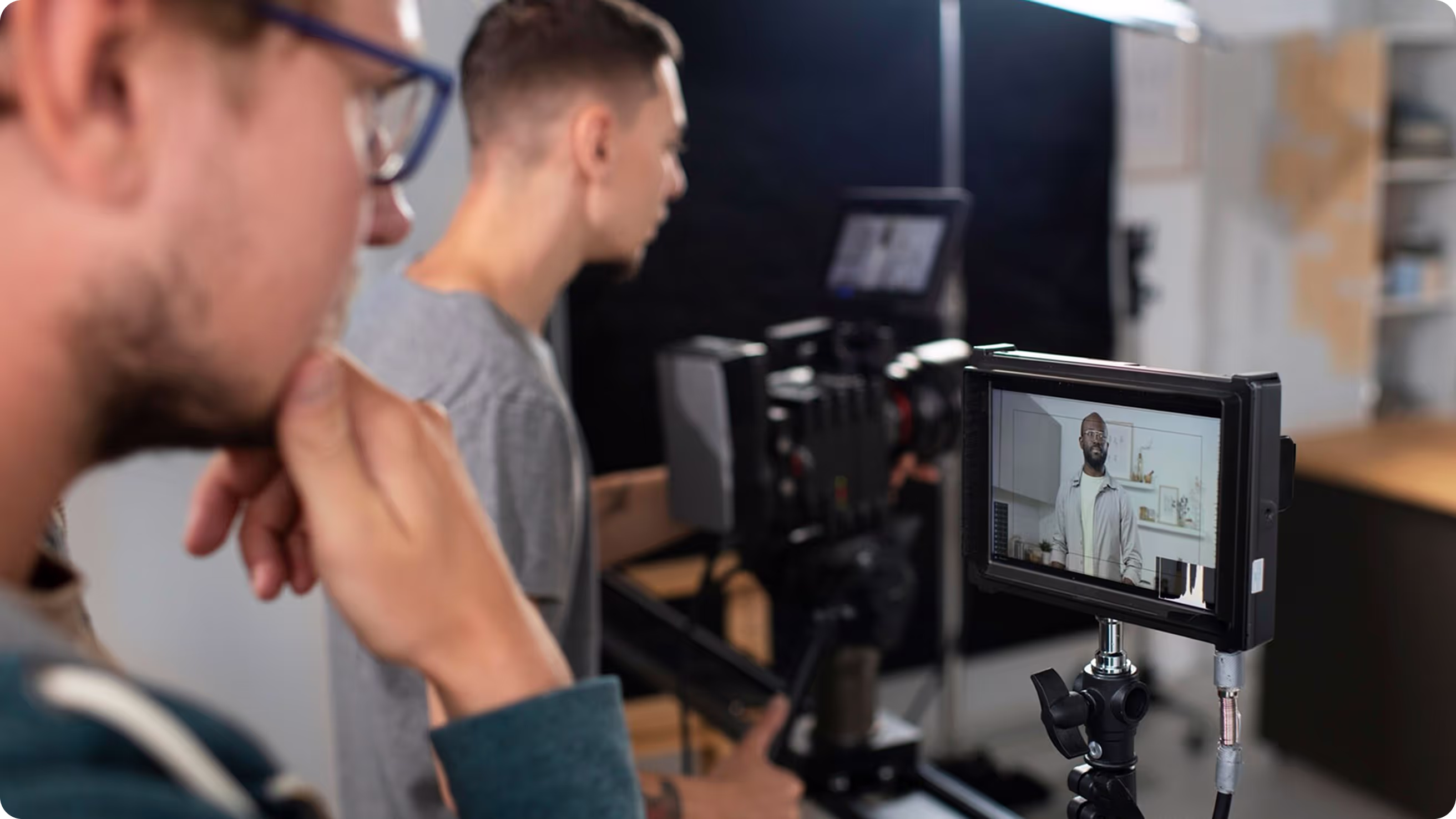 two mans works with videocamera